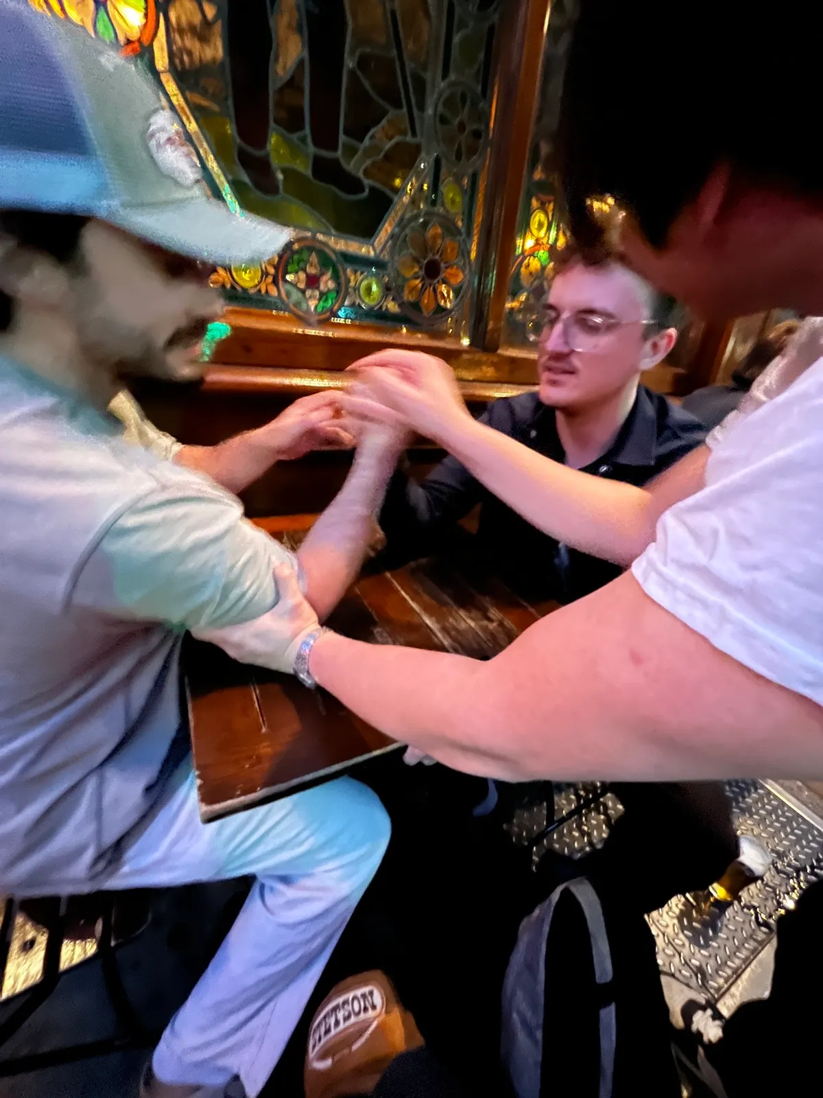 V7 team — boss arm-wrestling a colleague at the pub